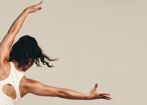 Photo of a woman working out and stretching out her arms