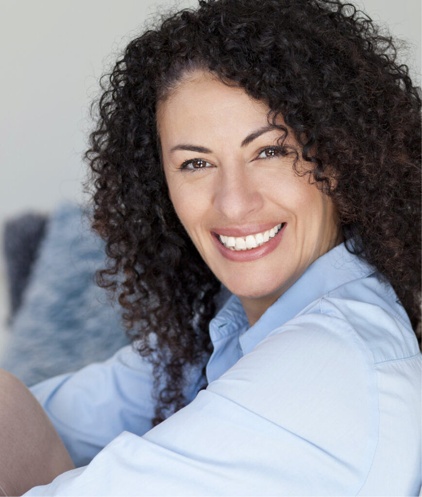 Woman with long, curly brown hair