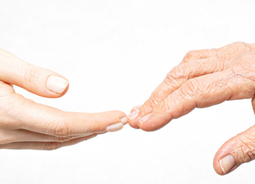 Photo of youthful hands and aging hands