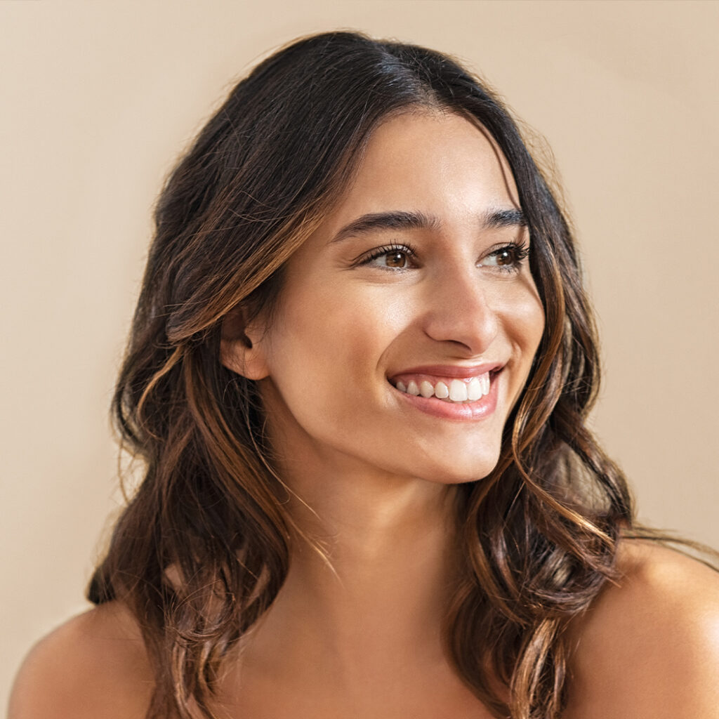 Photo of a smiling woman with brown hair